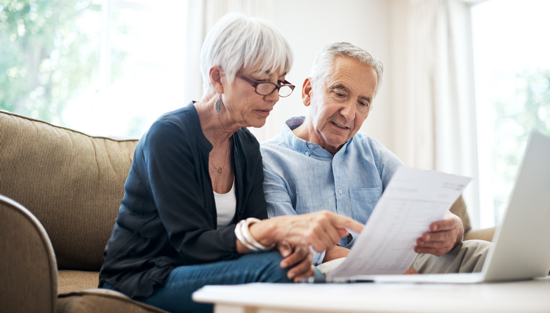 A senior couple making adjustments to their retirement plan.