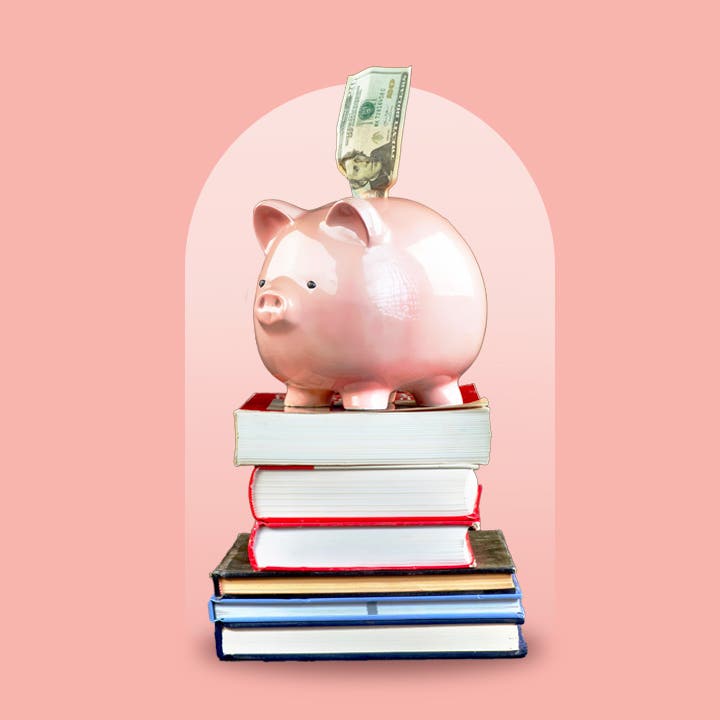 A piggy bank on a stack of books