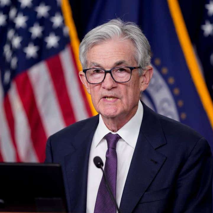 Federal Reserve Chair Jerome Powell speaking behind a podium.